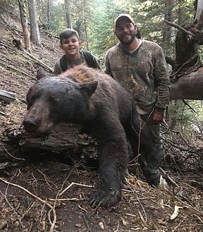 Father and son bear hunting.